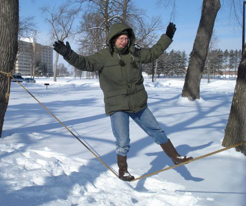 Picture of Steven Sahyun rope
	walking in winter.