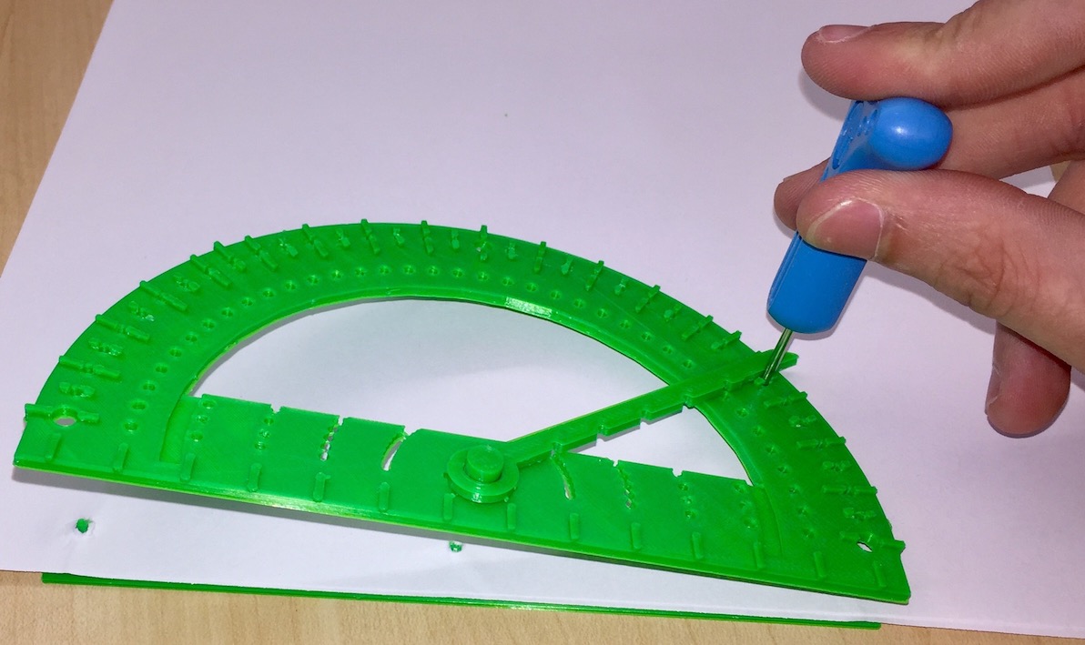 Picture of base plate, paper and protractor.