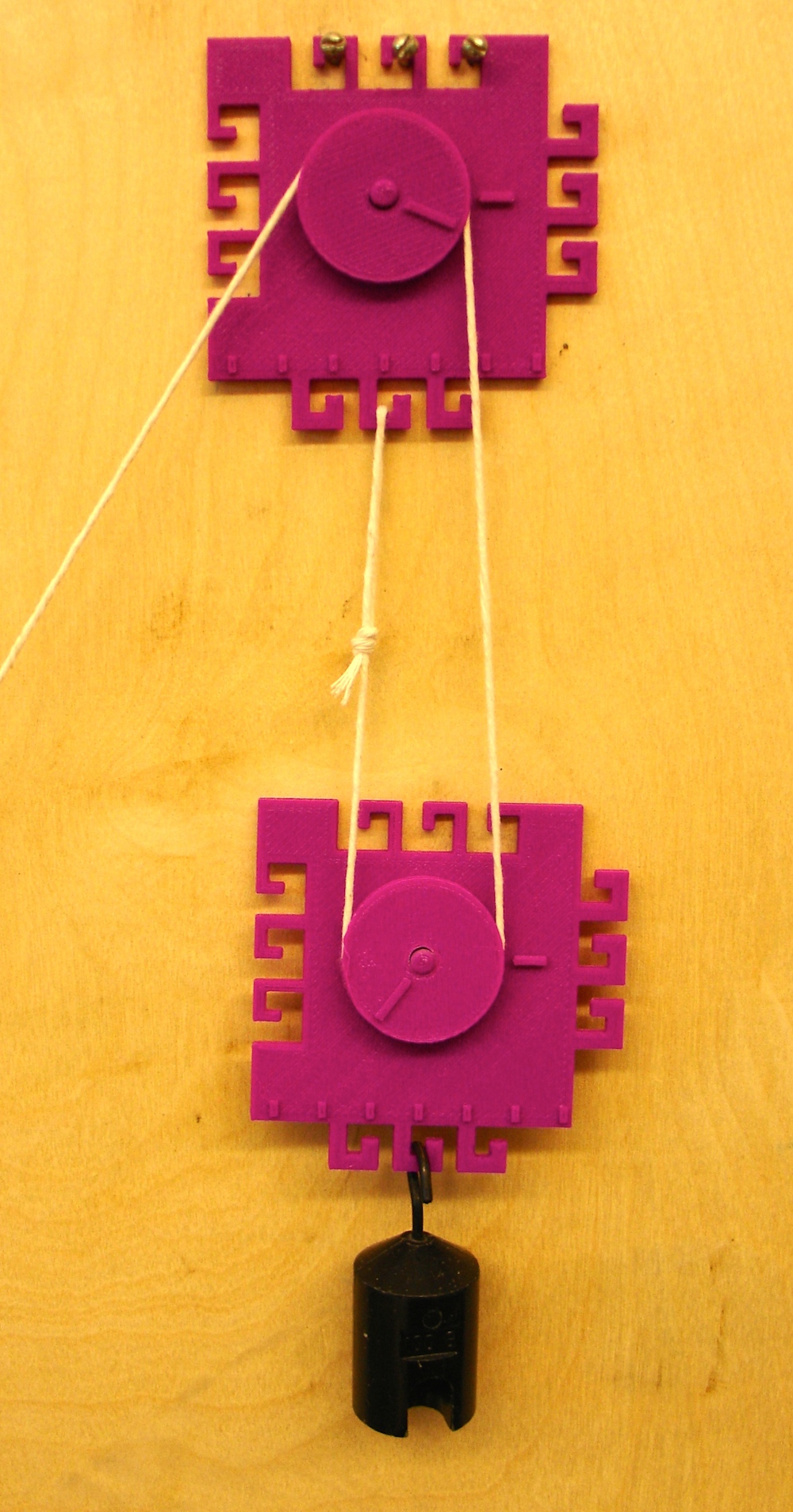 Picture of a two pulley system.